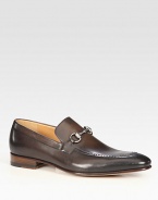 Burnished leather with silver horsebit detail. Leather sole Made in Italy 