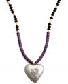 Show heart. Strung with wooden beads and a hand-cut and hammered pendant, this Heart of Haiti necklace is crafted by a co-op that supports women's employment in local communities.