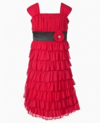 Allover ruffles give this dress a fun, flowy feel that provide a perfect complement to her lovely looks.