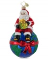 Make the world a better place. Santa looks out for the earth from the North Pole in a Christopher Radko ornament supporting environmental charities.