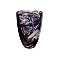 A stunning vase in breathtaking black features thin threads of glass that are hand-applied for a dazzling effect, making a perfect display item in your home.