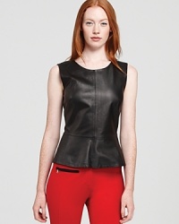 A leather Trink Turk top pick flaunts fall's trendsetting peplum waist for ladylike chic with a modern edge.