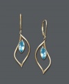 Cool blues. Earrings feature bezel-set blue topaz drops (2-1/2 ct. t.w.) crafted in a dainty 14k gold hoop setting. Approximate drop: 1-1/2 inches.