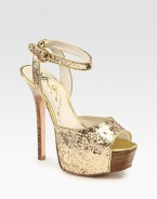 Uplifted by a stacked heel and partially covered platform, this glitzy metallic leather go-to has an adjustable ankle strap and a peep toe. Stacked heel, 5½ (140mm)Covered platform, 2 (50mm)Compares to a 3½ heel (90mm)Metallic leather and glitter-coated leather upperLeather lining and solePadded insoleImportedOUR FIT MODEL RECOMMENDS ordering one half size up as this style runs small. 