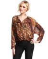 Animal attraction: a lush and earthy snakeskin-print provides ample cool to this blouson-style top from XOXO.