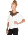 A sequin applique turns up the cool dial on this batwing sleeve blouson top from Urban Hearts!