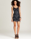 Adorned at front with a bead and lace leaf pattern, this Free People dress is cut in a body-con silhouette and finished with an exposed back zipper for the definition of modern femininity.