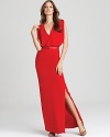 Make brilliant color your trademark in this RAOUL gown. A fiery hue ignites an ethereal silhouette, while a daring side slit finishes the style with a blaze of feminine glamour.