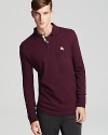 Exude effortless style with Burberry Brit's classic long sleeve polo.