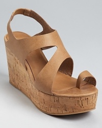 Natural cork forms a sturdy wedge on these Eileen Fisher sandals, a classic style with serious staying power.