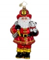 Santa to the rescue! Dressed in full uniform and carrying a hose and a cute little pup, Santa saves the day in this handcrafted, mouth-blown glass ornament from Christopher Radko. Perfect for the fireman in your family.