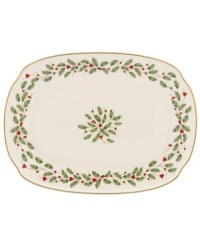 Perfect for entertaining, this large platter is trimmed with gold and a holly motif to match the beloved Lenox Holiday dinnerware collection.