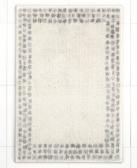 A breath of fresh air. Martha Stewart Collection revives your bathroom in carefree style with this Calendula bath rug, featuring a solid backdrop with a stripe border. Finished in soothing, neutral tones.