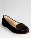 A timeless penny loafer from KORS Michael Kors stands the test of time in soft suede and a classic hue.