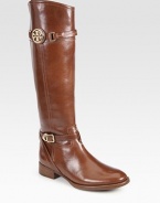 An equestrian-inspired style of polished leather, with the signature medallion and adjustable wrap-around strap. Stacked heel, 1¼ (30mm)Shaft, 17Leg circumference, 13¾Leather upperRubber solePadded insoleImportedOUR FIT MODEL RECOMMENDS ordering one half size up as this style runs small. 