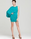 Allover draping lends a chic look to BCBGMAXAZRIA's short dress, showcasing a dramatic one-sleeve silhouette.