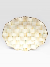 This remarkably unique platter, in hand-painted terra cotta with color-dragged checks and golden trim, creates an ultra-glamorous presentation piece for your guests.Ceramic with golden lustre16 X 22Hand washMade in the USA