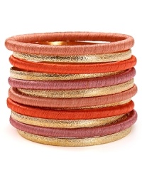 Cool girl style is all in the wrist--piled high with these boldly hued and subtly textured RJ Graziano bangles.