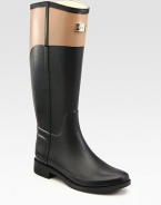 Waterproof classic in an equestrian-inspired, two-tone design. Rubber heel, 1 (25mm)Shaft, 15Leg circumference, 14Rubber upperPull-on styleJersey liningRubber solePadded insoleImported