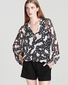 Cut from billowing silk chiffon, this DIANE von FURSTENBERG top touts a bold chain print for retro appeal.