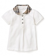 A short sleeve polo with a pleated check collar from Burberry.