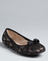 Belle of the ball, these lacy Salvatore Ferragamo ballet slippers will keep you poised and en point.