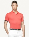 A sleek zipper replaces the conventional button front on a trim polo constructed from luxurious mercerized cotton.