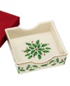 The most cherished seasonal pattern, in ivory fine porcelain trimmed in pure 24 karat gold. This napkin holder is the perfect addition to your holiday sideboard. Holder measures 5.75 and comes with red napkins.