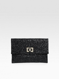 A cocktail essential covered in glittery fabric with a turnlock clasp and rich leather lining.Turnlock closure One inside open pocket Leather lining 9W X 6¼H X ½D Imported