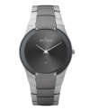 Exquisitely contemporary, this watch by Skagen Denmark is a modern masterpiece. Stainless steel bracelet with black plating at center links and round case with four lugs at bezel. Brushed charcoal dial features two silver tone hands and logo. Quartz movement. Water resistant to 30 meters. Limited lifetime warranty.