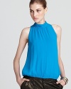 A high neck lends elegance to this vibrantly hued Alice + Olivia top. Exclusively at Bloomingdale's.