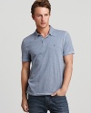 Give peace a chance in this calm, cool and collected polo from John Varvatos USA, detailed with contrast stitching for unique allover accents and tailored for a slim, modern fit.