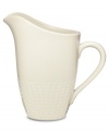 Sleek and simple in solid cream stoneware, the White Pepper creamer provides contemporary style for casual dining with an intriguing texture around its base, smooth body and soft spout. (Clearance)