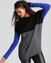 Embolden your look in this Aqua Cashmere color block sweater, cut in an oversized silhouette. Balance the loose fit with sleek leggings or your favorite skinnies for boy-meets-girl cool.