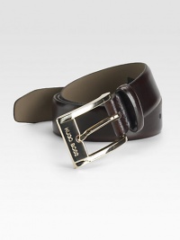 A smooth and sophisticated belt designed in fine calfskin leather with a shiny gold buckle. About 1 wide Imported 