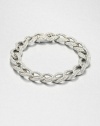 Tapered leaf-shaped links, encrusted with pavé crystals, form an elegantly simple chain bracelet with endless sparkle.CrystalRhodium platingLength, about 7¼Width, about ½Box-and-tongue claspImported