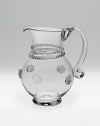 Old-world style and a fluid, mouthblown shape define the elegant design of a small pitcher ideal for any occasion. 19-ounce capacity 6 high Hand wash Imported