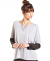 Coated sleeves supply REIGN's knit top with legitimate downtown edge!