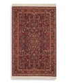 A long runner that is ideal for hallways and entryways. Richly detailed and deeply colored, the exotic floral motif of this rug made its debut in twentieth-century America and has remained a favorite. Individual skein-dyeing imparts a jewel-tone clarity to the rich red, green and ivory palette. A patented wash process creates a soft vintage finish faithful to the craftsmanship of the original. Woven in the USA of premium fully worsted New Zealand wool.