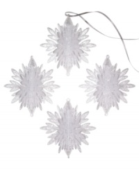 Shimmer and shine. Add a look of winter wonderment to your tree with this set of four snowflake ornaments embellished with silver sparkles for a luminous quality.