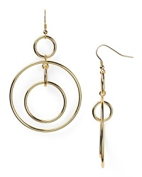 Shapely and striking. RJ Graziano puts a fresh spin on the classic hoop earring with linked circular drops in gold plated metal.