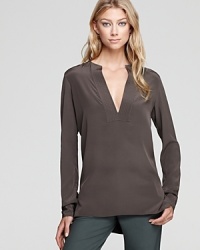 A daring deep V lends added allure to this Vince top made from pure silk.