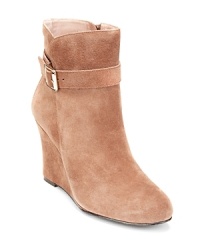 Buckle-up-these high-flying VINCE CAMUTO booties are perched on wearable wedges.