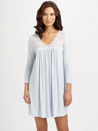 A silky-knit with a feminine-silhouette and a pretty stretch-lace neckline for the ultimate in fit and design. V-neckSemi-sheer lace yokeShirring for added drapeThree-quarter length sleevesAbout 36 from shoulder to hem95% modal/5% spandexMachine washImported