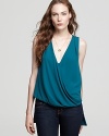 A stylish twist on a classic tank, this soft knit top featuring a feminine draped front for layer-perfect style.