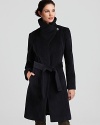 The sculpted silhouette on this Calvin Klein belted coat features a warm funnel neck and tie closure for a cinched waist.