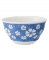 Vintage charm meets modern durability in the Farmhouse Touch rice bowl, featuring fresh white blooms on cornflower-blue porcelain from Villeroy & Boch.