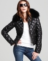 Sporting diamond quilting and a plush fur collar, this feather and down-filled SAM. jacket makes cozy-chic simple.