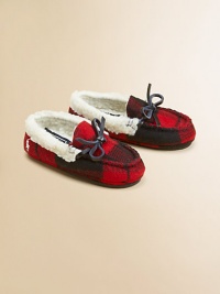 A classic slip-on slipper lined in plush faux shearling with a preppy woven plaid design.Slip-onWool upperFaux shearling liningRubber solePadded insoleImported