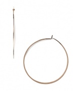 A striking yet slim silhouette makes these classic hoop earrings feminine and refined. From MICHAEL Michael Kors.